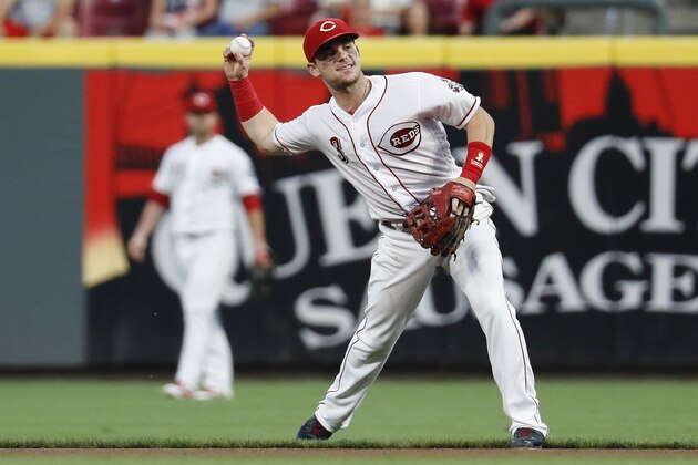 Cincinnati Reds second baseman Scooter Gennett fields a ground out by Milwaukee Brewers' Eric Thames in the seventh inning of a baseball game, Friday, June 29, 2018, in Cincinnati. (AP Photo/John Minchillo)