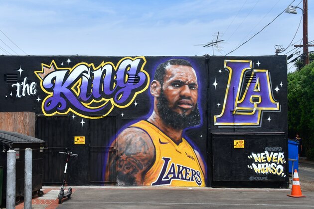 A mural of LeBron James in a Los Angeles Lakers jersey is viewed in Venice, California on July 9, 2018. - It was originally revealed July 6, 2018, and then vandalized over the weekend, and re-touched up again with the word 'of' not repainted from the original words 'the King of LA'. Artists Jonas Never and Menso One painted the mural to welcome LeBron James to Los Angeles, outside the Baby Blues BBQ resturant in Venice, California. (Photo by Frederic J. BROWN / AFP) / RESTRICTED TO EDITORIAL USE - MANDATORY MENTION OF THE ARTIST UPON PUBLICATION - TO ILLUSTRATE THE EVENT AS SPECIFIED IN THE CAPTION        (Photo credit should read FREDERIC J. BROWN/AFP/Getty Images)