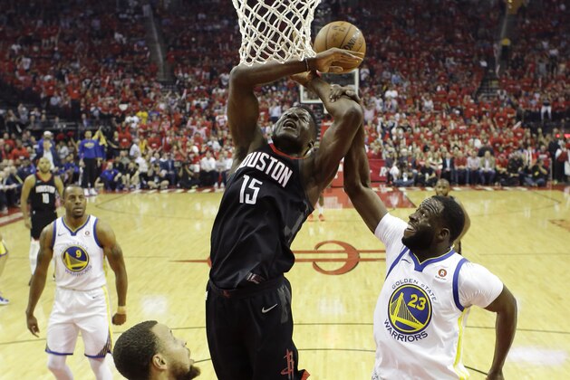 Houston Rockets center Clint Capela (15) is fouled by Golden State Warriors forward Draymond Green (23) as he tries to score in the first half during Game 2 of the NBA Western Conference Finals, Wednesday, May 16, 2018, in Houston. (AP Photo/David J. Phillip)