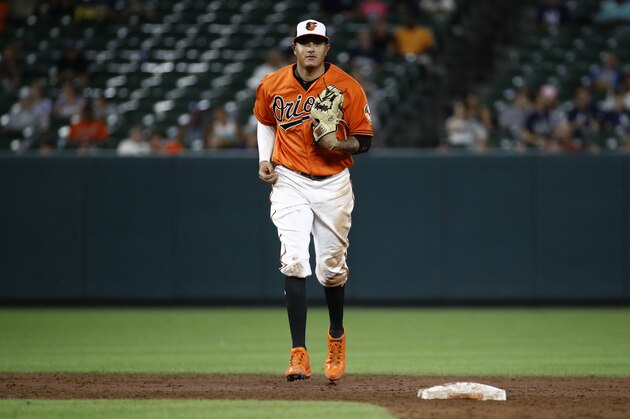 Baltimore Orioles shortstop Manny Machado runs on the field between innings of the second baseball game of a doubleheader against the New York Yankees, Monday, July 9, 2018, in Baltimore. (AP Photo/Patrick Semansky)