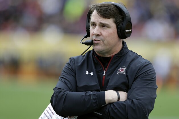 FILE - In this Jan. 1, 2018, file photo, South Carolina head coach Will Muschamp watches during the first half of the Outback Bowl NCAA college football game against Michigan in Tampa, Fla. Muschamp led the Gamecocks to a 9-4 record, their best in four years, last fall. Now, he’s looking to take another step forward to the top of the Southeastern Conference as he and his team open spring practice this week. (AP Photo/Chris O'Meara, File)