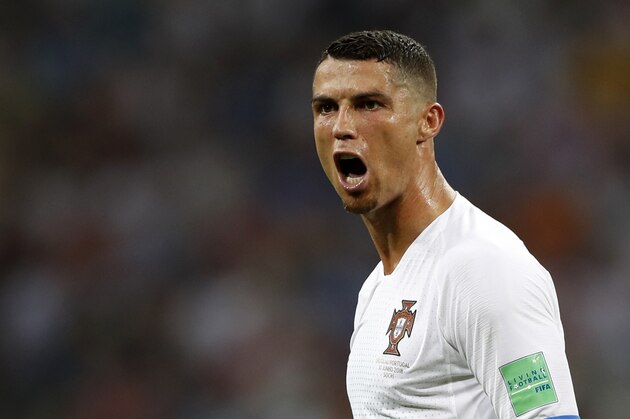 FILE - In this file photo dated Saturday, June 30, 2018, Portugal's Cristiano Ronaldo reacts during the round of 16 match between Uruguay and Portugal during the 2018 soccer World Cup at the Fisht Stadium in Sochi, Russia. Cristiano Ronaldo is leaving Real Madrid it is announced Tuesday July 10, 2018, to join Italian club Juventus, bringing to an end a hugely successful nine-year spell in Spain. (AP Photo/Francisco Seco, FILE)