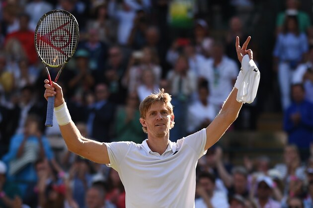 TOPSHOT - South Africa's Kevin Anderson celebrates after winning against Switzerland's Roger Federer during their men's singles quarter-finals match on the ninth day of the 2018 Wimbledon Championships at The All England Lawn Tennis Club in Wimbledon, southwest London, on July 11, 2018. - Anderson won the match 2-6, 6-7, 7-5, 6-4, 13-11. (Photo by Oli SCARFF / AFP) / RESTRICTED TO EDITORIAL USE        (Photo credit should read OLI SCARFF/AFP/Getty Images)