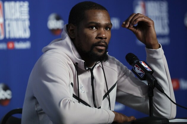Golden State Warriors forward Kevin Durant attends a news conference following Game 3 of basketball's NBA Finals, early Wednesday June 7, 2018, in Cleveland. The Warriors defeated the Cleveland Cavaliers 110-102 to take a 3-0 lead in the series. (AP Photo/Tony Dejak)