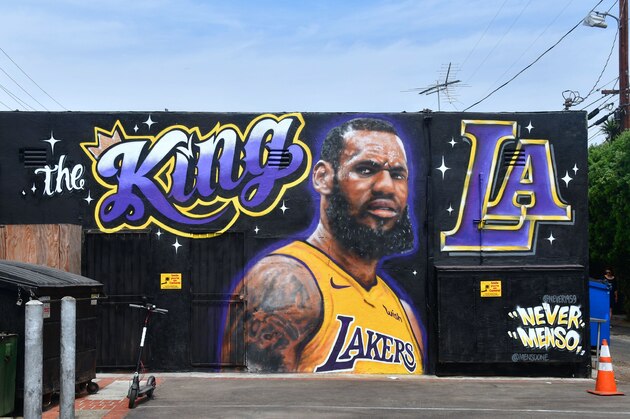 A mural of LeBron James in a Los Angeles Lakers jersey is viewed in Venice, California on July 9, 2018. - It was originally revealed July 6, 2018, and then vandalized over the weekend, and re-touched up again with the word 'of' not repainted from the original words 'the King of LA'. Artists Jonas Never and Menso One painted the mural to welcome LeBron James to Los Angeles, outside the Baby Blues BBQ resturant in Venice, California. (Photo by Frederic J. BROWN / AFP) / RESTRICTED TO EDITORIAL USE - MANDATORY MENTION OF THE ARTIST UPON PUBLICATION - TO ILLUSTRATE THE EVENT AS SPECIFIED IN THE CAPTION        (Photo credit should read FREDERIC J. BROWN/AFP/Getty Images)