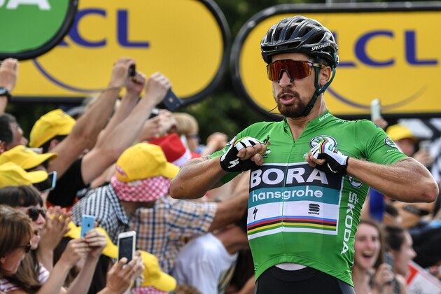 Slovakia's Peter Sagan celebrates as he crosses the finish line to win the fifth stage of the 105th edition of the Tour de France cycling race between Lorient and Quimper, western France, on July 11, 2018. (Photo by Marco BERTORELLO / AFP)        (Photo credit should read MARCO BERTORELLO/AFP/Getty Images)