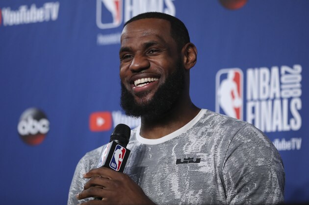 Cleveland Cavaliers forward LeBron James takes questions at a press conference after the basketball team's practiced during the NBA Finals, Thursday, June 7, 2018, in Cleveland. The Warriors lead the series 3-0 with Game 4 on Friday. (AP Photo/Carlos Osorio)