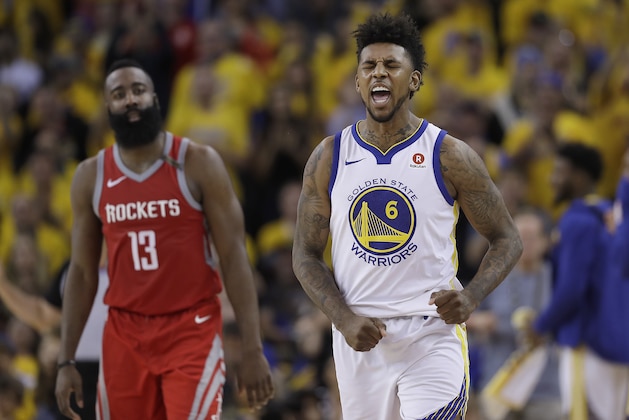 Golden State Warriors guard Nick Young (6) celebrates in front of Houston Rockets guard James Harden (13) during the second half of Game 6 of the NBA basketball Western Conference Finals in Oakland, Calif., Saturday, May 26, 2018. (AP Photo/Marcio Jose Sanchez)