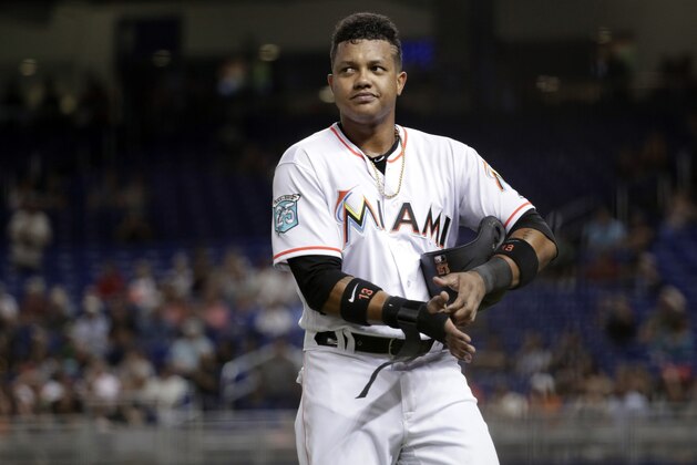 Miami Marlins' Starlin Castro walks off after striking out during a baseball game against the San Francisco Giants, Tuesday, June 12, 2018, in Miami. (AP Photo/Lynne Sladky)