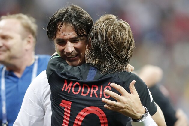 Croatia's Luka Modric celebrates with head coach Zlatko Dalic after advancing to the final during the semifinal match between Croatia and England at the 2018 soccer World Cup in the Luzhniki Stadium in Moscow, Russia, Wednesday, July 11, 2018. (AP Photo/Frank Augstein)