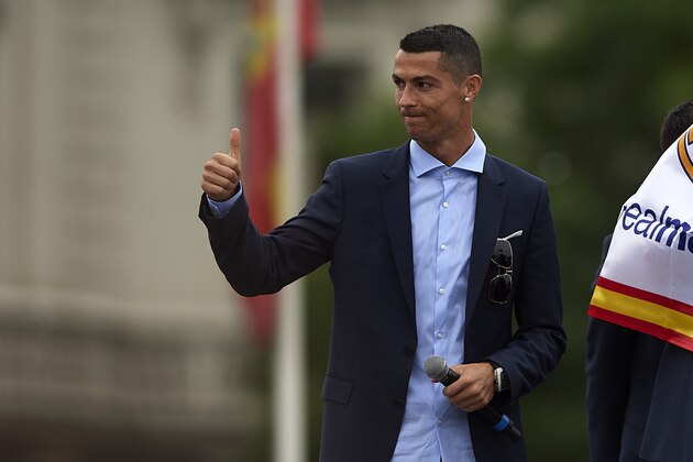 MADRID, SPAIN - MAY 27:  Cristiano Ronaldo of Real Madrid reacts during Real Madrid team celebration at Cibeles Square after winning their 13th European Cup on May 27, 2018 in Madrid, Spain.  (Photo by Quality Sport Images/Getty Images)