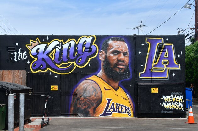 A mural of LeBron James in a Los Angeles Lakers jersey is viewed in Venice, California on July 9, 2018. - It was originally revealed July 6, 2018, and then vandalized over the weekend, and re-touched up again with the word 'of' not repainted from the original words 'the King of LA'. Artists Jonas Never and Menso One painted the mural to welcome LeBron James to Los Angeles, outside the Baby Blues BBQ resturant in Venice, California. (Photo by Frederic J. BROWN / AFP) / RESTRICTED TO EDITORIAL USE - MANDATORY MENTION OF THE ARTIST UPON PUBLICATION - TO ILLUSTRATE THE EVENT AS SPECIFIED IN THE CAPTION        (Photo credit should read FREDERIC J. BROWN/AFP/Getty Images)