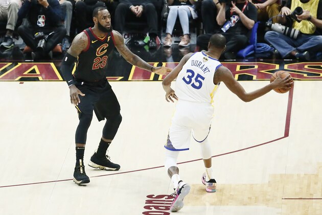 CLEVELAND, CA - JUN 8:  Kevin Durant #35 of the Golden State Warriors passes the ball against LeBron James #23 of the Cleveland Cavaliers in Game Four of the 2018 NBA Finals won 108-85 by the Golden State Warriors over the Cleveland Cavaliers at the Quicken Loans Arena on June 6, 2018 in Cleveland, Ohio. NOTE TO USER: User expressly acknowledges and agrees that, by downloading and or using this photograph, User is consenting to the terms and conditions of the Getty Images License Agreement. Mandatory Copyright Notice: Copyright 2018 NBAE (Photo by Chris Elise/NBAE via Getty Images)