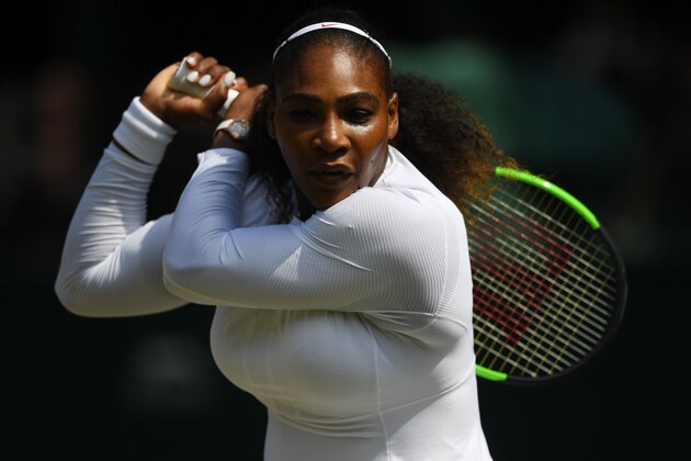 US player Serena Williams returns against Germany's Julia Goerges during their women's singles semi-final match on the tenth day of the 2018 Wimbledon Championships at The All England Lawn Tennis Club in Wimbledon, southwest London, on July 12, 2018. (Photo by NEIL HALL / various sources / AFP) / RESTRICTED TO EDITORIAL USE        (Photo credit should read NEIL HALL/AFP/Getty Images)