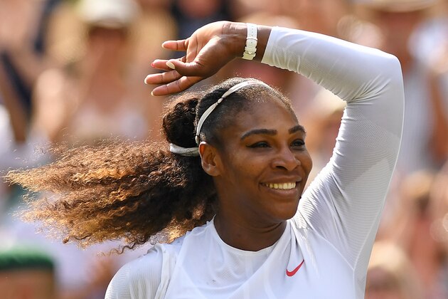 US player Serena Williams celebrates after beating Germany's Julia Goerges 6-2, 6-4 in their women's singles semi-final match on the tenth day of the 2018 Wimbledon Championships at The All England Lawn Tennis Club in Wimbledon, southwest London, on July 12, 2018. (Photo by Glyn KIRK / AFP) / RESTRICTED TO EDITORIAL USE        (Photo credit should read GLYN KIRK/AFP/Getty Images)