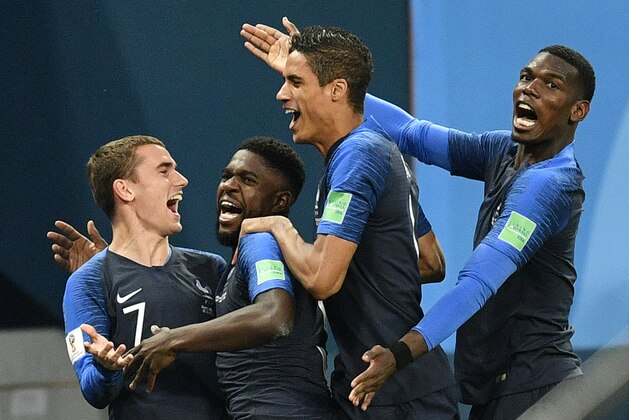 France's Samuel Umtiti, second from left, is congratulated by his teammates France's Antoine Griezmann, Raphael Varane and Paul Pogba, from left, after scoring the opening goal during the semifinal match between France and Belgium at the 2018 soccer World Cup in the St. Petersburg Stadium in St. Petersburg, Russia, Tuesday, July 10, 2018. (AP Photo/Martin Meissner) France's Samuel Umtiti, second from left, is congratulated by his teammates France's Antoine Griezmann, Raphael Varane and Paul Pogba, from left, after scoring the opening goal during the semifinal match between France and Belgium at the 2018 soccer World Cup in the St. Petersburg Stadium in St. Petersburg, Russia, Tuesday, July 10, 2018. (AP Photo/Martin Meissner)