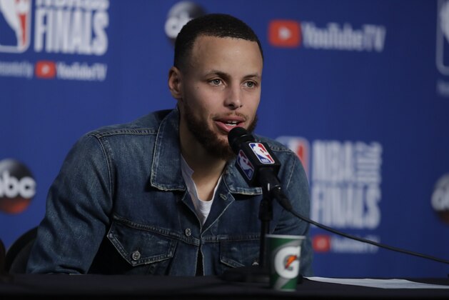 Golden State Warriors guard Stephen Curry speaks during a news conference following Game 3 of basketball's NBA Finals against the Cleveland Cavaliers, early Wednesday June 7, 2018, in Cleveland. The Warriors defeated the Cavaliers 110-102 to take a 3-0 lead in the series. (AP Photo/Tony Dejak)