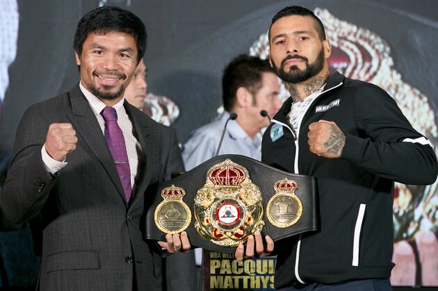 Philippine senator and boxing hero Manny Pacquiao, left, poses with Argentine WBA welterweight champion Lucas Matthysse during a press conference, in Kuala Lumpur, Malaysia, Thursday, July 12, 2018. Matthysse and Pacquiao were scheduled to fight on July 15, for the World Boxing Association welterweight title in Malaysia. (AP Photo/Yam G-Jun)