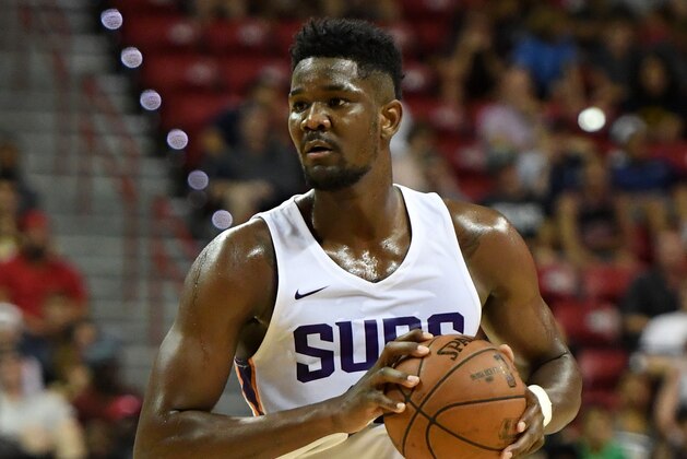 LAS VEGAS, NV - JULY 09:  Deandre Ayton #22 of the Phoenix Suns looks to pass against the Orlando Magic during the 2018 NBA Summer League at the Thomas & Mack Center on July 9, 2018 in Las Vegas, Nevada. The Suns defeated the Magic 71-53. NOTE TO USER: User expressly acknowledges and agrees that, by downloading and or using this photograph, User is consenting to the terms and conditions of the Getty Images License Agreement.  (Photo by Ethan Miller/Getty Images)