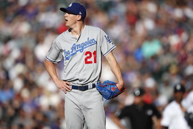 Los Angeles Dodgers starting pitcher Walker Buehler reacts after giving up an RBI-single to Colorado Rockies' Charlie Blackmon in the second inning of a baseball game Saturday, June 2, 2018, in Denver. (AP Photo/David Zalubowski)