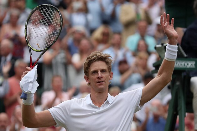 South Africa's Kevin Anderson reacts after winning against US player John Isner during the final set tie-break of their men's singles semi-final match on the eleventh day of the 2018 Wimbledon Championships at The All England Lawn Tennis Club in Wimbledon, southwest London, on July 13, 2018. - Anderson won the match 7-6, 6-7, 6-7, 6-4, 26-24. (Photo by Daniel LEAL-OLIVAS / AFP) / RESTRICTED TO EDITORIAL USE        (Photo credit should read DANIEL LEAL-OLIVAS/AFP/Getty Images)