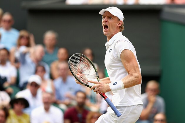LONDON, ENGLAND - JULY 13:  Kevin Anderson of South Africa celebrates a point against John Isner of The United States during their Men's Singles semi-final match on day eleven of the Wimbledon Lawn Tennis Championships at All England Lawn Tennis and Croquet Club on July 13, 2018 in London, England.  (Photo by Matthew Stockman/Getty Images)