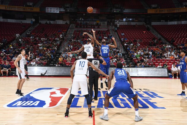 LAS VEGAS, NV - JULY 13: Mitchell Robinson #26 of the New York Knicks and Cliff Alexander #45 of the New Orleans Pelicans reach for the opening tip-off during the 2018 Las Vegas Summer League on July 13, 2018 at the Thomas & Mack Center in Las Vegas, Nevada. NOTE TO USER: User expressly acknowledges and agrees that, by downloading and/or using this photograph, user is consenting to the terms and conditions of the Getty Images License Agreement. Mandatory Copyright Notice: Copyright 2018 NBAE (Photo by Garrett Ellwood/NBAE via Getty Images)