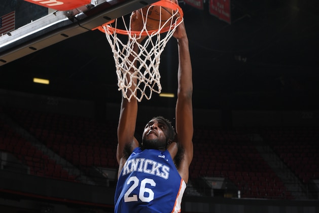 LAS VEGAS, NV - JULY 12:  Mitchell Robinson #26 of the New York Knicks drives to the basket against the Boston Celtics during the 2018 Las Vegas Summer League on July 12, 2018 at the Thomas & Mack Center in Las Vegas, Nevada. NOTE TO USER: User expressly acknowledges and agrees that, by downloading and/or using this Photograph, user is consenting to the terms and conditions of the Getty Images License Agreement. Mandatory Copyright Notice: Copyright 2018 NBAE (Photo by Garrett Ellwood/NBAE via Getty Images)