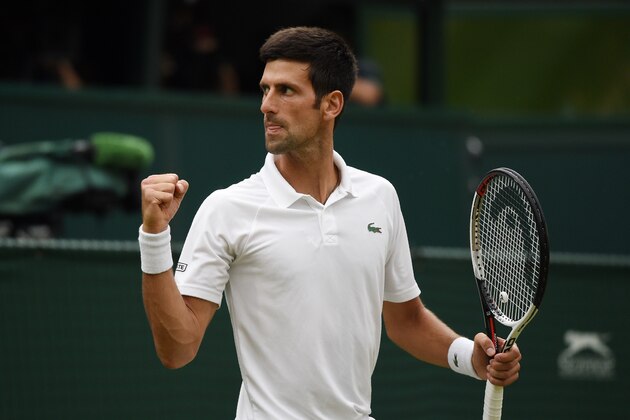 Serbia's Novak Djokovic reacts after breaking serve against Spain's Rafael Nadal during the continuation of their men's singles semi-final match on the twelfth day of the 2018 Wimbledon Championships at The All England Lawn Tennis Club in Wimbledon, southwest London, on July 14, 2018. (Photo by Oli SCARFF / AFP) / RESTRICTED TO EDITORIAL USE        (Photo credit should read OLI SCARFF/AFP/Getty Images)