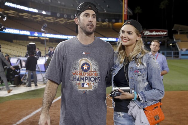 Houston Astros' Justin Verlander celebrates with Kate Upton after Game 7 of baseball's World Series against the Los Angeles Dodgers Wednesday, Nov. 1, 2017, in Los Angeles. The Astros won 5-1 to win the series 4-3. (AP Photo/Jae C. Hong)