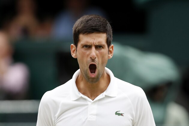 Serbia's Novak Djokovic reacts against Spain's Rafael Nadal during the continuation of their men's singles semi-final match on the twelfth day of the 2018 Wimbledon Championships at The All England Lawn Tennis Club in Wimbledon, southwest London, on July 14, 2018. (Photo by NIC BOTHMA / POOL / AFP) / RESTRICTED TO EDITORIAL USE        (Photo credit should read NIC BOTHMA/AFP/Getty Images)