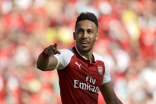 Arsenal's Pierre-Emerick Aubameyang celebrates scoring his side's first goal during the English Premier League soccer match between Arsenal and Burnley at the Emirates Stadium in London, Sunday, May 6, 2018. The match is Arsenal manager Arsene Wenger's last home game in charge after announcing in April he will stand down as Arsenal coach at the end of the season after nearly 22 years at the helm. (AP Photo/Matt Dunham)