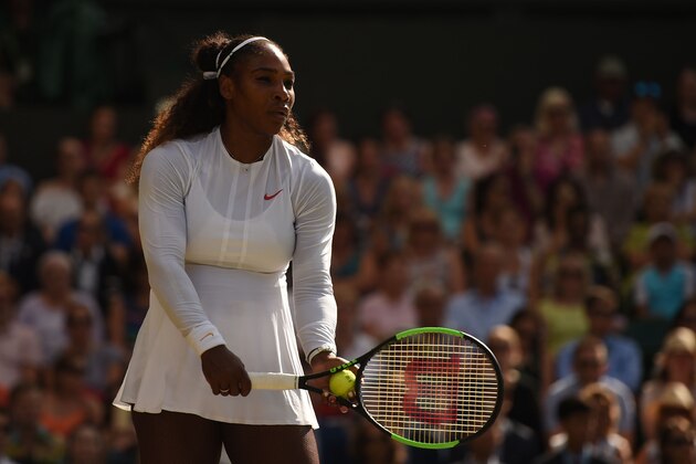 US player Serena Williams prepares to serve against Germany's Angelique Kerber during their women's singles final match on the twelfth day of the 2018 Wimbledon Championships at The All England Lawn Tennis Club in Wimbledon, southwest London, on July 14, 2018. (Photo by Oli SCARFF / AFP) / RESTRICTED TO EDITORIAL USE        (Photo credit should read OLI SCARFF/AFP/Getty Images)