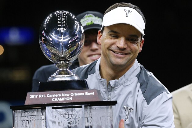 NEW ORLEANS, LA - DECEMBER 16:  Head coach Neal Brown of the Troy Trojans celebrates with the trophy after the R+L Carriers New Orleans Bowl against the North Texas Mean Green at the Mercedes-Benz Superdome on December 16, 2017 in New Orleans, Louisiana. The Troy Trojans won 50-30.  (Photo by Jonathan Bachman/Getty Images)
