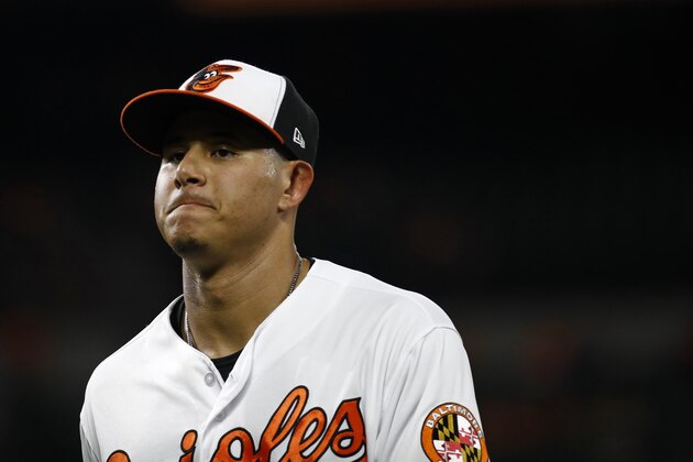 Baltimore Orioles shortstop Manny Machado walks on the field during a baseball game against the Philadelphia Phillies, Thursday, July 12, 2018, in Baltimore. (AP Photo/Patrick Semansky)