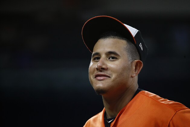 Baltimore Orioles shortstop Manny Machado walks on the field between innings of the second baseball game of a doubleheader against the New York Yankees, Monday, July 9, 2018, in Baltimore. (AP Photo/Patrick Semansky)