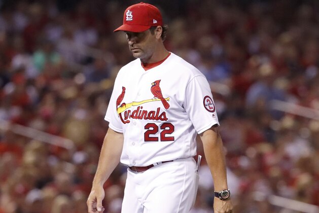 St. Louis Cardinals manager Mike Matheny walks out to the mound to make a pitching change during the sixth inning of a baseball game against the Cincinnati Reds Friday, July 13, 2018, in St. Louis. (AP Photo/Jeff Roberson)