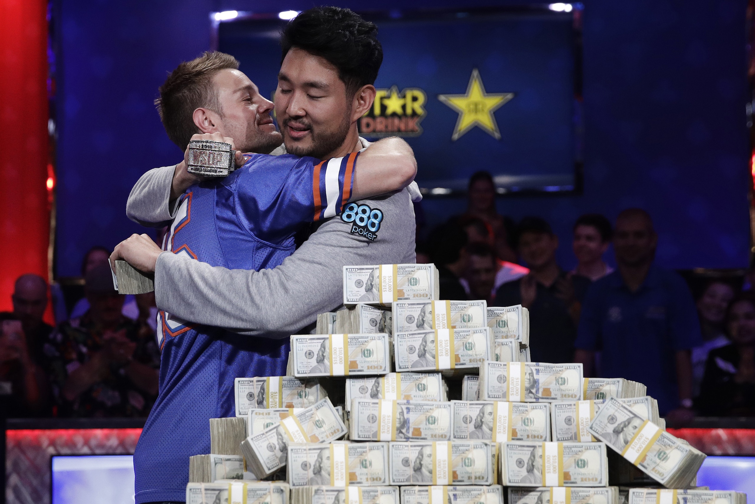 Tony Miles, left, embraces first place finisher John Cynn after the World Series of Poker main event, Sunday, July 15, 2018, in Las Vegas. (AP Photo/John Locher) Tony Miles, left, embraces first place finisher John Cynn after the World Series of Poker main event, Sunday, July 15, 2018, in Las Vegas. (AP Photo/John Locher)