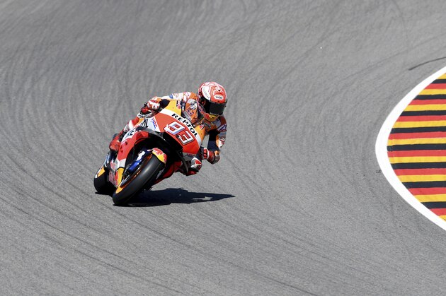 Spain's Marc Marquez of the Repsol Honda Team speeds at a free training session on the eve of the MotoGP race in Hohenstein-Ernstthal, eastern Germany, Saturday, July 14, 2018. (Hendrik Schmidt/dpa via AP)