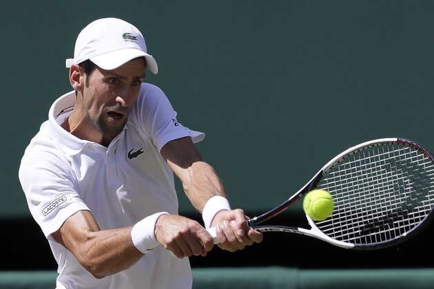 Serbia's Novak Djokovic returns the ball to South Africa's Kevin Anderson during the men's singles final match, at the Wimbledon Tennis Championships, in London, Sunday July 15, 2018.(AP Photo/Kirsty Wigglesworth)
