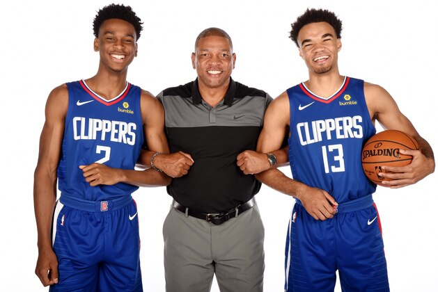 PLAYA VISTA, CA - JUNE 25:  Draft picks Shai Gilgeous-Alexander #2 and Jerome Robinson #13 of the LA Clippers pose for a photo with Head Coach Doc Rivers during the Draft Press Conference at the Clippers Training Facility in Playa Vista, California on June 25, 2018 at Clippers Training Facility. NOTE TO USER: User expressly acknowledges and agrees that, by downloading and or using this photograph, User is consenting to the terms and conditions of the Getty Images License Agreement. Mandatory Copyright Notice: Copyright 2018 NBAE (Photo by Andrew D. Bernstein/NBAE via Getty Images)