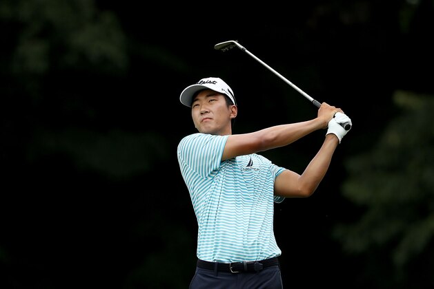 SILVIS, IL - JULY 15:  Michael Kim reacts hits a shot on the first hole during the final round of the John Deere Classic at TPC Deere Run on July 15, 2018 in Silvis, Illinois.  (Photo by Streeter Lecka/Getty Images)