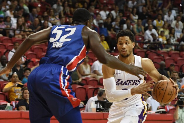 LAS VEGAS, NV - JULY 15:  Josh Hart #5 of the Los Angeles Lakers drives against Nnanna Egwu #52 of the Detroit Pistons during a quarterfinal game of the 2018 NBA Summer League at the Thomas & Mack Center on July 15, 2018 in Las Vegas, Nevada. NOTE TO USER: User expressly acknowledges and agrees that, by downloading and or using this photograph, User is consenting to the terms and conditions of the Getty Images License Agreement.  (Photo by Ethan Miller/Getty Images)