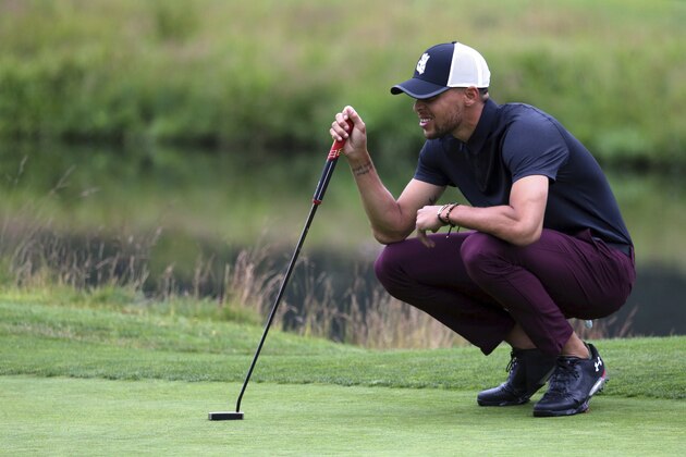 Golden State Warriors All-Star guard Stephen Curry lines up a putt on the first green during the first round at the American Century Golf Championship, Friday, July 13, 2018, at the Edgewood Tahoe Golf Course in Stateline, Nev. (AP Photo/Lance Iversen)
