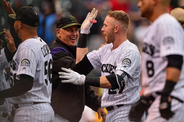 DENVER, CO - JULY 15: Trevor Story #27 and manager Bud Black #10 of the Colorado Rockies celebrate a ninth-inning walk-off home run by Story and a 4-3 win over the Seattle Mariners at Coors Field on July 15, 2018 in Denver, Colorado.  (Photo by Dustin Bradford/Getty Images)