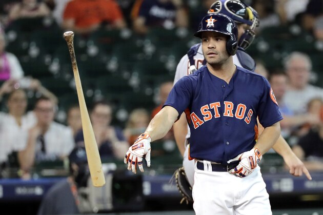 Houston Astros' Jose Altuve tosses his bat after striking out to end the first inning of a baseball game Sunday, July 15, 2018, in Houston. (AP Photo/David J. Phillip)