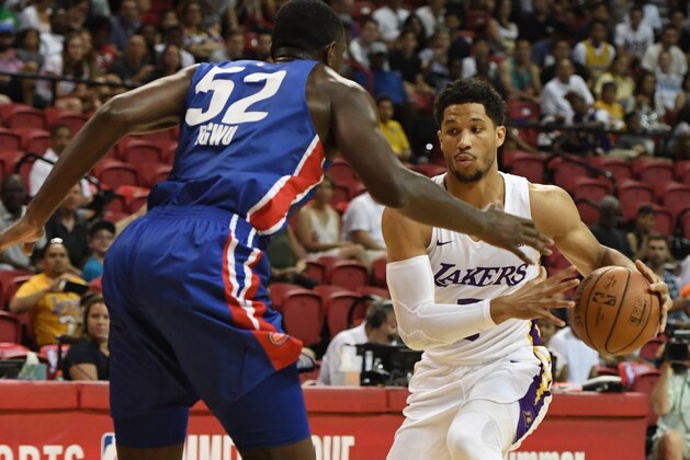 LAS VEGAS, NV - JULY 15:  Josh Hart #5 of the Los Angeles Lakers drives against Nnanna Egwu #52 of the Detroit Pistons during a quarterfinal game of the 2018 NBA Summer League at the Thomas & Mack Center on July 15, 2018 in Las Vegas, Nevada. NOTE TO USER: User expressly acknowledges and agrees that, by downloading and or using this photograph, User is consenting to the terms and conditions of the Getty Images License Agreement.  (Photo by Ethan Miller/Getty Images)