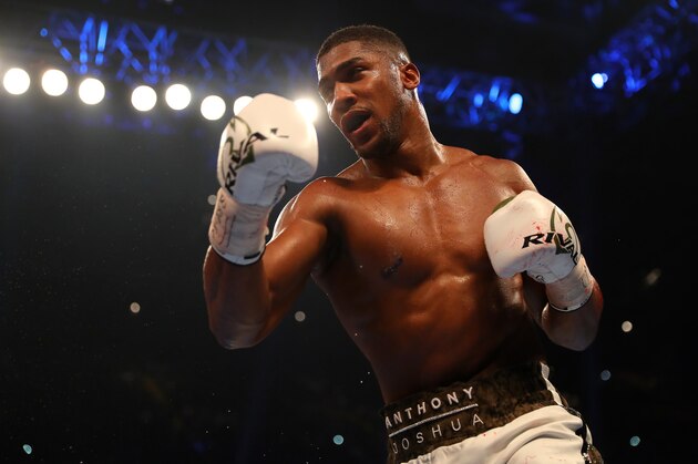 CARDIFF, WALES - OCTOBER 28:  Anthony Joshua (white trunks) and Carlos Takam (black trunks) in action during their IBF, WBA & IBO Heavyweight Championship contest at Principality Stadium on October 28, 2017 in Cardiff, Wales. (Photo by Richard Heathcote/Getty Images)