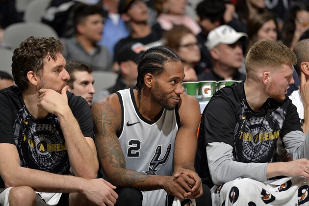 SAN ANTONIO, TX - JANUARY 13:  Pau Gasol #16 of the San Antonio Spurs, Kawhi Leonard #2 of the San Antonio Spurs, and Davis Bertans #42 of the San Antonio Spurs look on against the Denver Nuggets on January 13, 2018 at the AT&T Center in San Antonio, Texas. NOTE TO USER: User expressly acknowledges and agrees that, by downloading and or using this photograph, user is consenting to the terms and conditions of the Getty Images License Agreement. Mandatory Copyright Notice: Copyright 2018 NBAE (Photos by Mark Sobhani/NBAE via Getty Images)