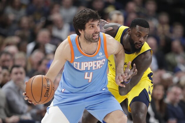 Indiana Pacers guard Lance Stephenson (1) defends Los Angeles Clippers guard Milos Teodosic (4) during the second half of an NBA basketball game in Indianapolis, Friday, March 23, 2018. The Pacers defeated the Clippers 109-104. (AP Photo/Michael Conroy)
